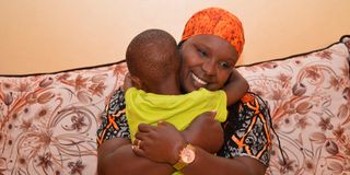 Alexie Chebet Towett with his son Luke Kerich at Kiamunyi Estate on the outskirts of Nakuru City