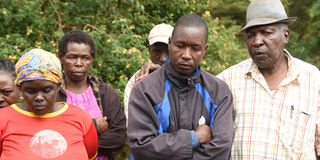 John Kirwa (centre), whose wife - Sheila Jepkemoi Kirwa  was allegedly beheaded by her side lover on Monday night 