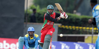 Kenya captain Rakep Patel plays a delivery away from Rwanda's wicketkeeper Ndikubwimana Didier