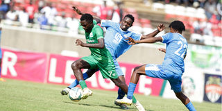 Gor Mahia midfielder Austin Odhiambo vies with Nairobi City Stars midfielders Andrew Kisilu and Samuel Kapen