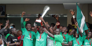 Gor Mahia players celebrate with the trophy