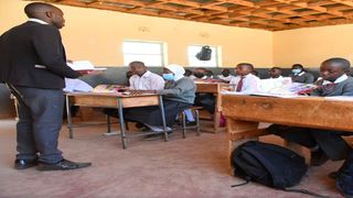 A teacher takes Junior Secondary School students through an English lesson