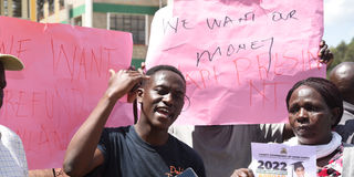 A parent in tears during protests over the Finland and Canada education airlift saga in Kapseret, Eldoret, Uasin Gishu county