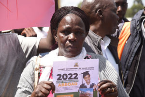 A parent affected in the messy Uasin Gishu Overseas Education program in tears during a protest at the governor's office