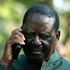 Azimio leader Raila Odinga in a phone call during Azimio Parliamentary Group Presser at Kalonzo Command Centre