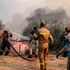 Firemen attempt to extinguish a fire in Nea Anchialo, Greece