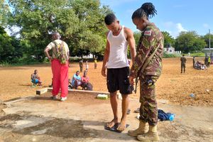 Youth being inspected by soldiers during KDF recruitment in Lamu
