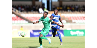 Gor Mahia defender Emery Bayisenge (left) vies with AFC Leopards forward Brian Yakhama
