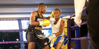 Kenya's Fatuma Zarika (left) fights against Tanzania's Fatuma Yazidu