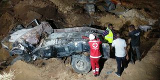 Wreckage of the truck that was buried following the landslide at the Pekeche quarry in Kashani
