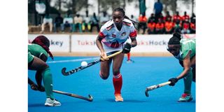 Kenya women's hockey team player Naomi Kemunto in action against Nigeria