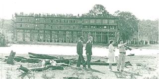 Queen Elizabeth II and Prince Philip (second left) at the site of the old Treetops Hotel