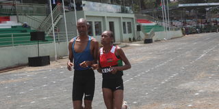 Nancy Chelangat (right) and her guide Geoffrey Rono compete in the women's 1,500 metres (T11) race