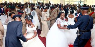 National Police Service couples dance after their wedding 