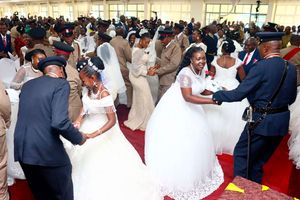 National Police Service couples dance after their wedding 