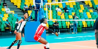 Kenya Pipeline libero Aggripina Kundu (right) receives the ball 