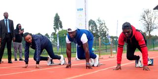 Africa 100m record holder Ferdinand Omanyala (centre) with Visa Country Manager Eva Ngigi-Sarwari