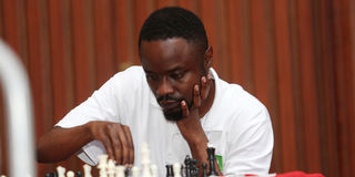 Joseph Methu ponders his next move during his match against Mehul Gohil 