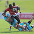 Kenya Sevens player Brian Tanga weaves through Germany's defence