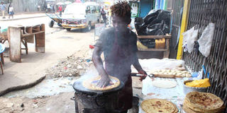 A man prepares chapati