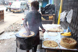 A man prepares chapati