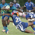 Austine Sikutwa (left) of KCB skips past Gideon Makumi of Strathmore Leos