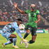 Nigeria's forward Victor Osimhen (right) vies for the ball with Cameroon's goalkeeper Fabrice Ondoa