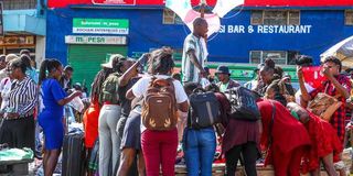 Shoppers look through second-hand clothes at Gikomba Market