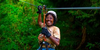 Joanna Neema zip lining at Kereita forest at one of Matembezi Travelers Club. 