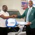 CFAO Deputy Managing Director Chris Ndala (left) hands over a key to Kenya Open Commercial Director Ronald Meru