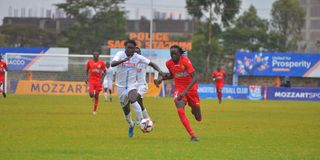 Kenya Police striker Tito Okello (right) vies with Posta Rangers defender Bernard Ondiek