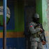 A Haitian soldier stands guard near the Toussaint Louverture International Airport