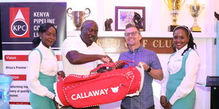 Kenya Pipeline Company General Manager Operations Derrik Okova (second left) awards Brendan Ireland 