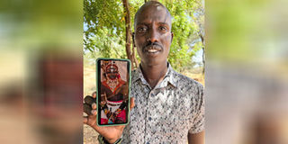 Jacob Leresh holds a photograph of his brother Tilam Leresh