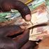 Counting Kenya Shilling Notes
