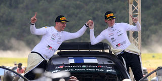 Kalle Rovanpera celebrates with his navigator Jonne Haltunnen