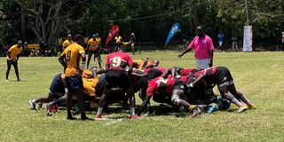 South Coast Pirates (yellow) and Mombasa RFC (red) engage in a scrum