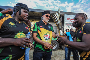 Rai Group of Companies Chairman Jaswant Singh Rai (centre) with Kabras Sugar RFC players