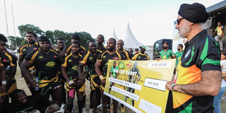 Rai Group of Companies Chairman Jaswant Singh Rai (centre) with Kabras Sugar RFC players