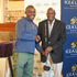 ICEA LION Group Chairman Joe Wangai awards the winner of Patron's Putter Gregory Mburu 