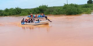 boat crossing a flooded area from Madogo to Garissa town