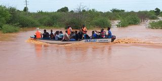 A boat crossing a flooded area from Madogo to Garissa town