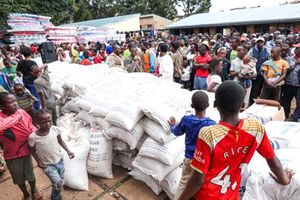 People affected by floods wait for humanitarian aid at Valley Bridge Primary School