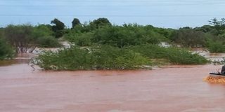 boat crossing a flooded area from Madogo to Garissa town