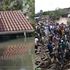 Left: A submerged house in Runda estate and ongoing demolitions in Mathare slums.