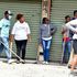 Various shop owners along Ronald Ngala Street on July 2, 2024 stand guard outside to secure their businesses premises