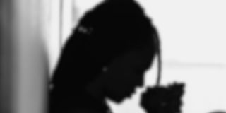 Silhouette meditative black woman praying