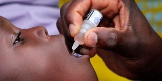 health officer administers polio vaccines 