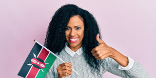 woman holding kenya flag