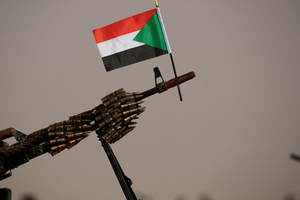 Sudanese national flag is attached to a machine gun of Paramilitary Rapid Support Forces (RSF) soldiers